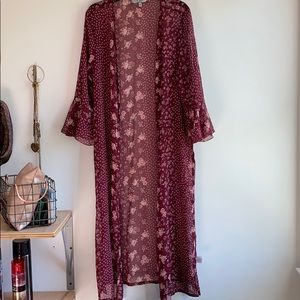 a flowy, long, see-through cardigan